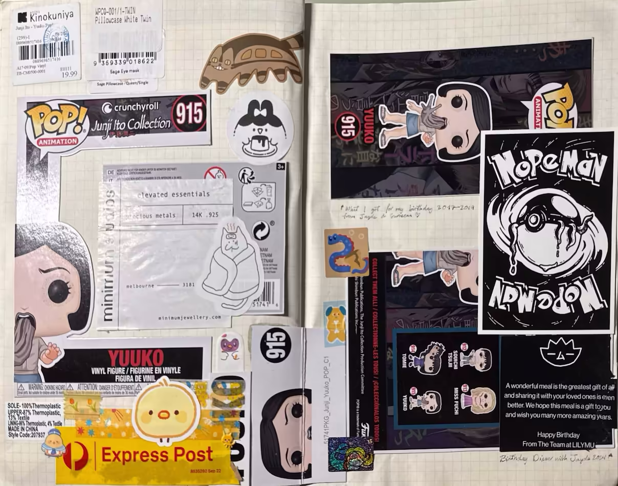 Spread with the Junji Ito Funko Pop packaging box 'Yuuko'. There are yellow washi tapes with yellow Aus Post 'Express Post' tape with a yellow chick and yellow black and a restaurant happy birthday card.